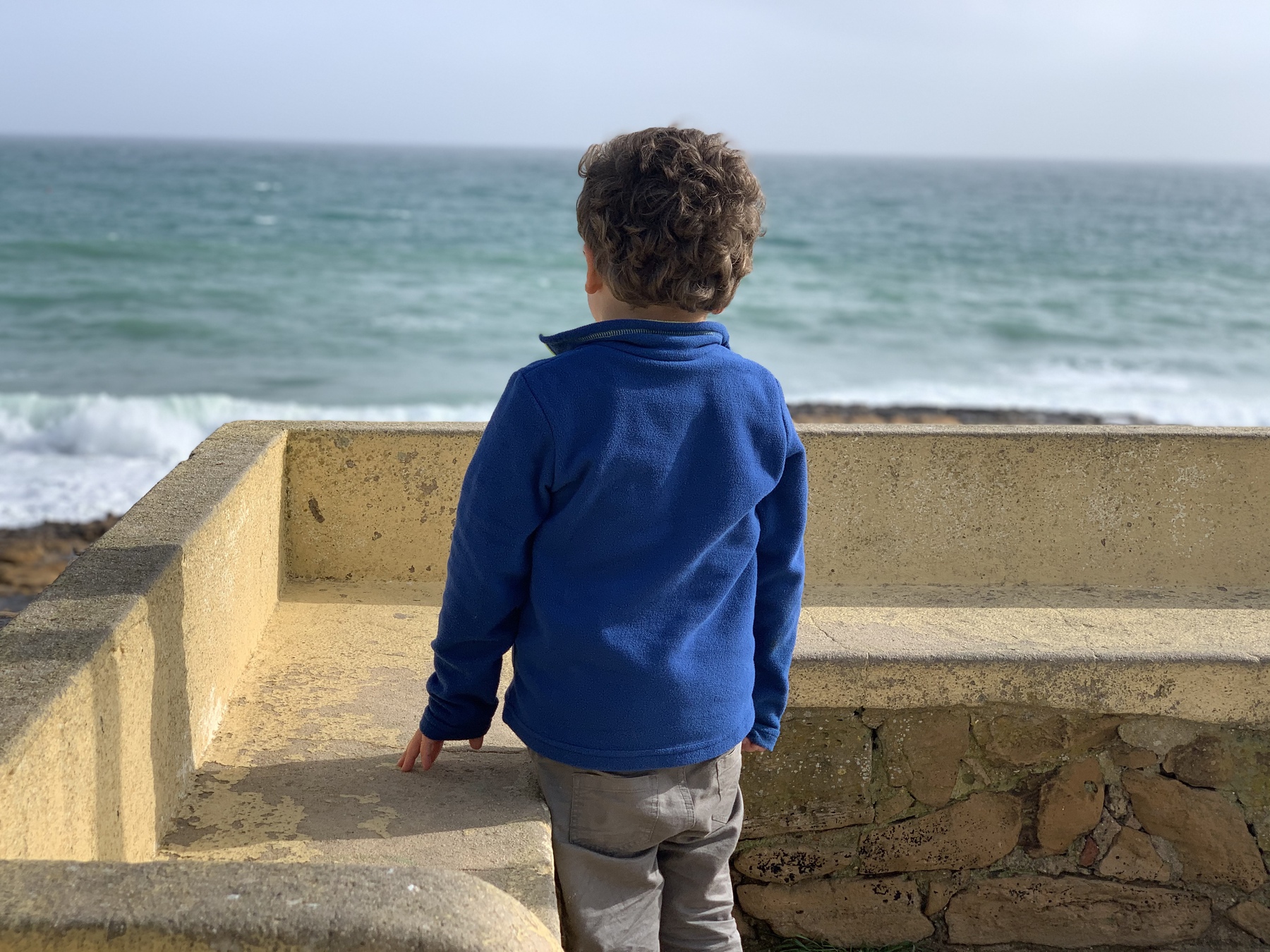 boy looking at sea