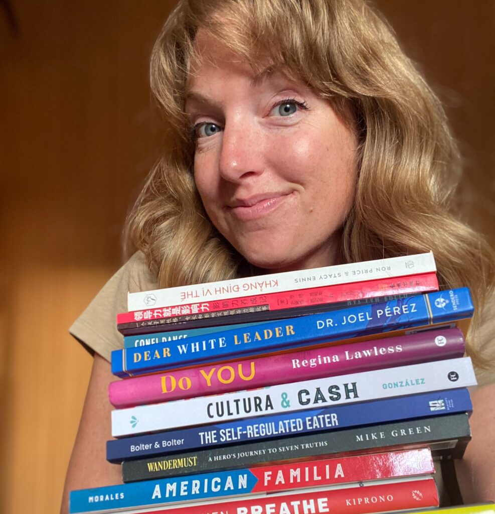 Stacy Ennis holding books